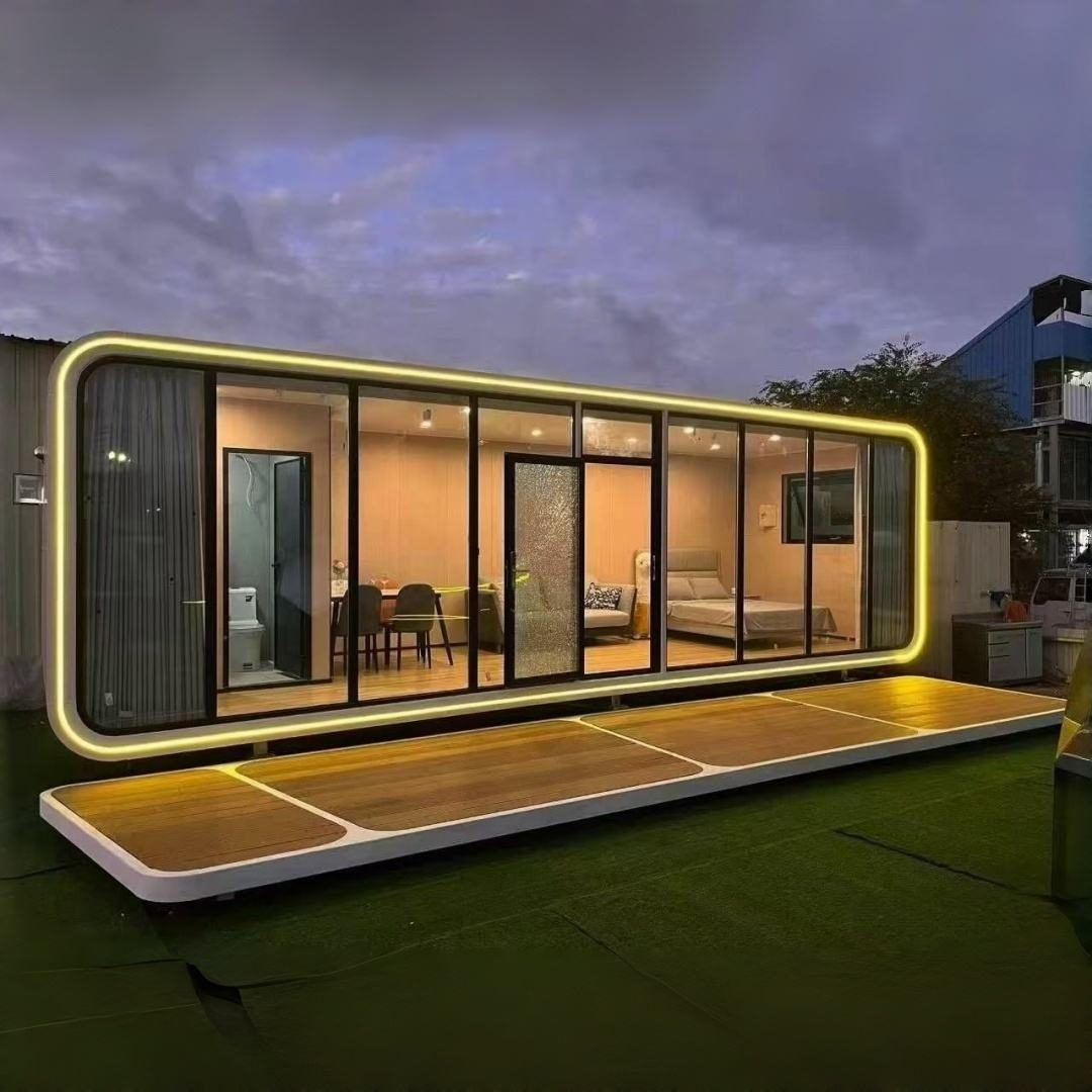 The Tara One-Bed modular home lit up at dusk